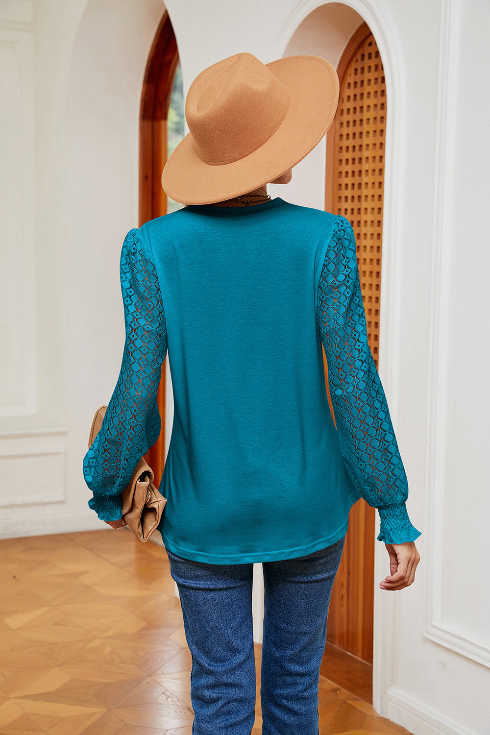 Teal contrast V-neck blouse, back view, with sheer patterned long sleeves