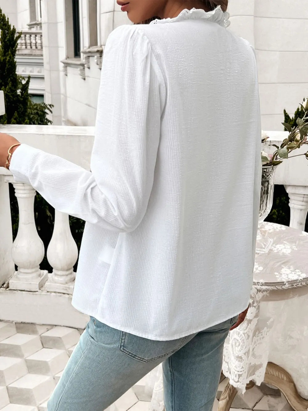 White long-sleeve button shirt with textured fabric and back seam detail