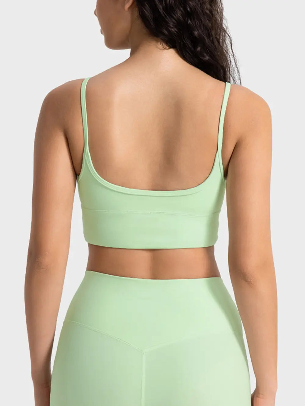 Light green spaghetti strap sport bra with scoop back