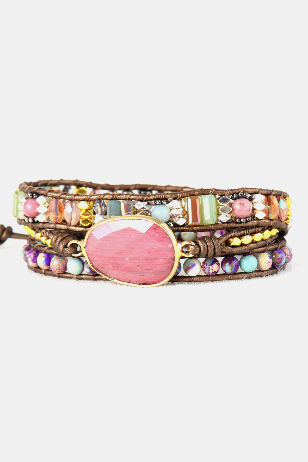 Beaded wrap bracelet with oval pink cabochon and colorful crystal and stone beads