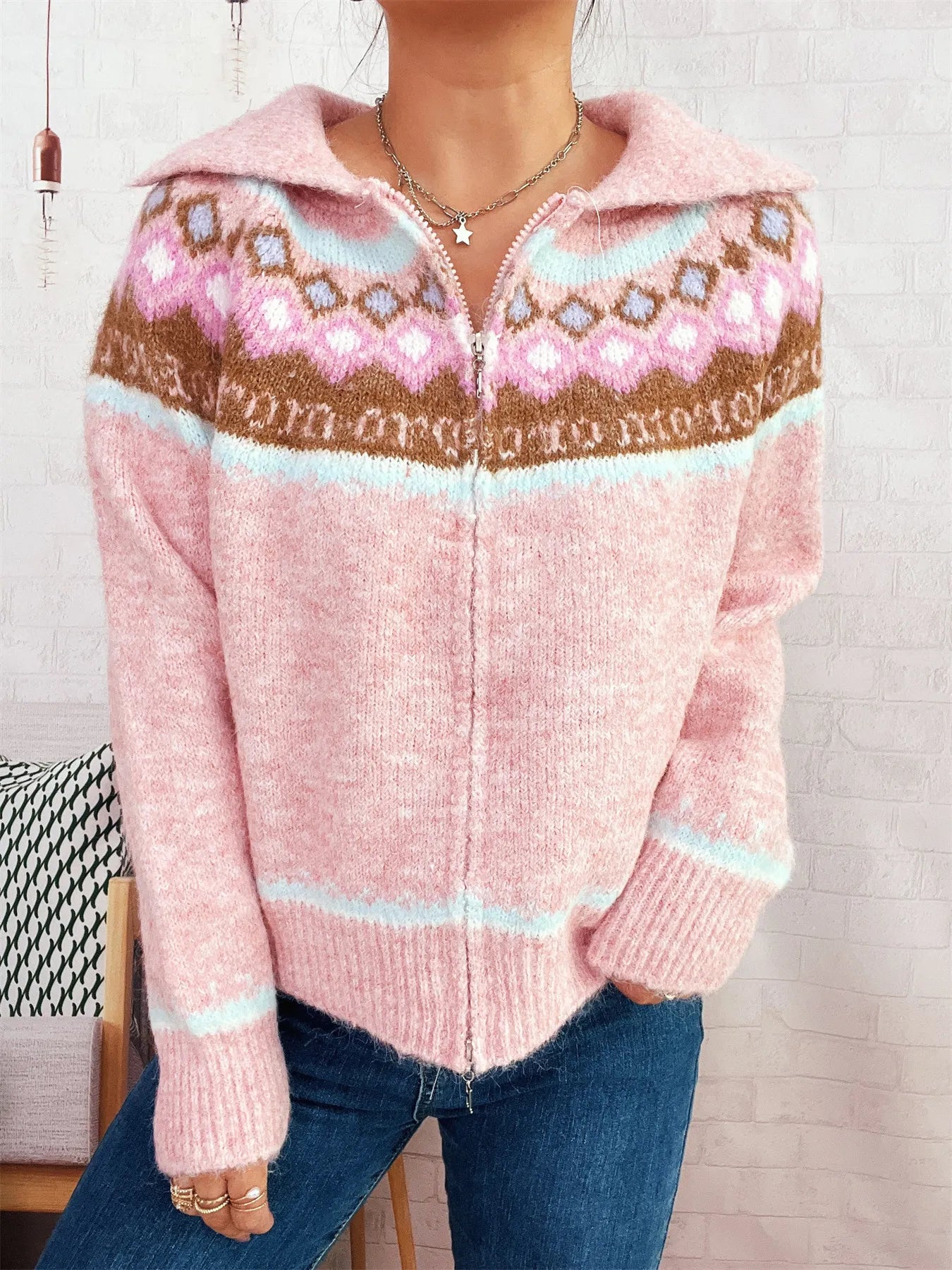 Pink Fair Isle zip-up cardigan with hooded collar, centered zipper placket