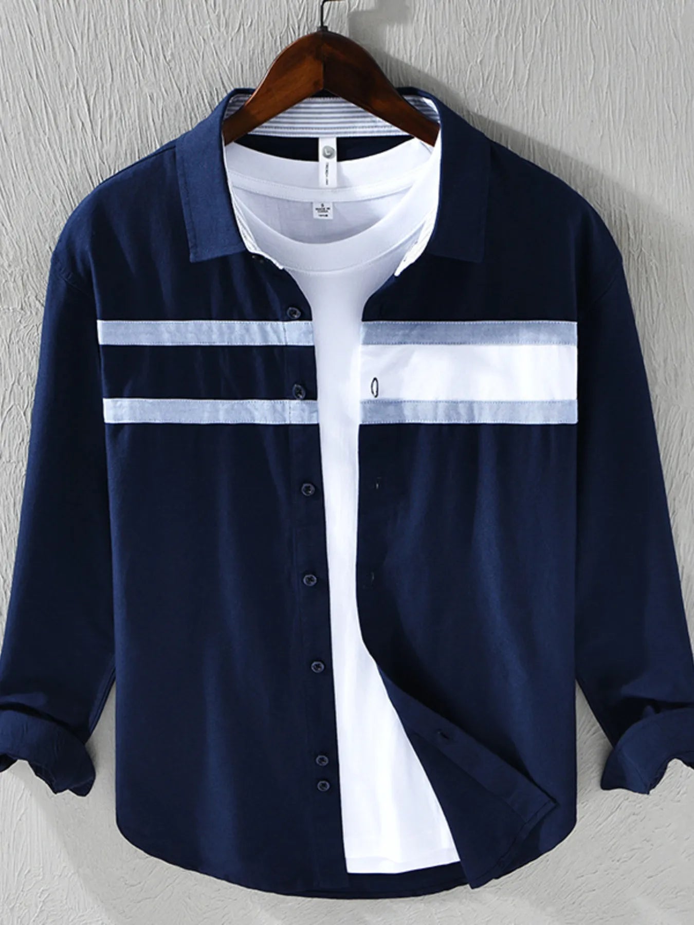 Navy striped button-down shirt with white horizontal bands and button placket