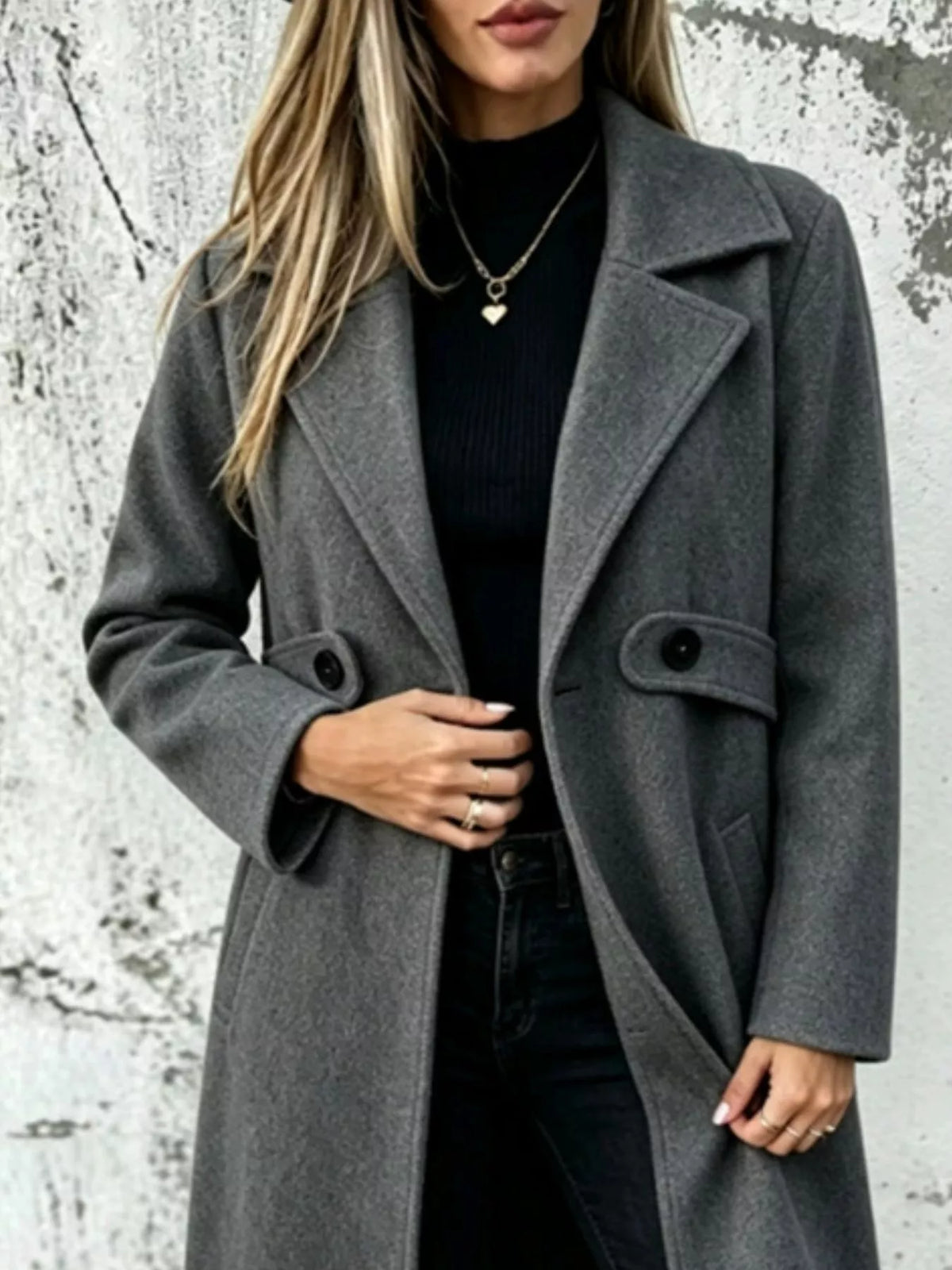 Charcoal gray longline button-lapel coat with flap pockets and front buttons