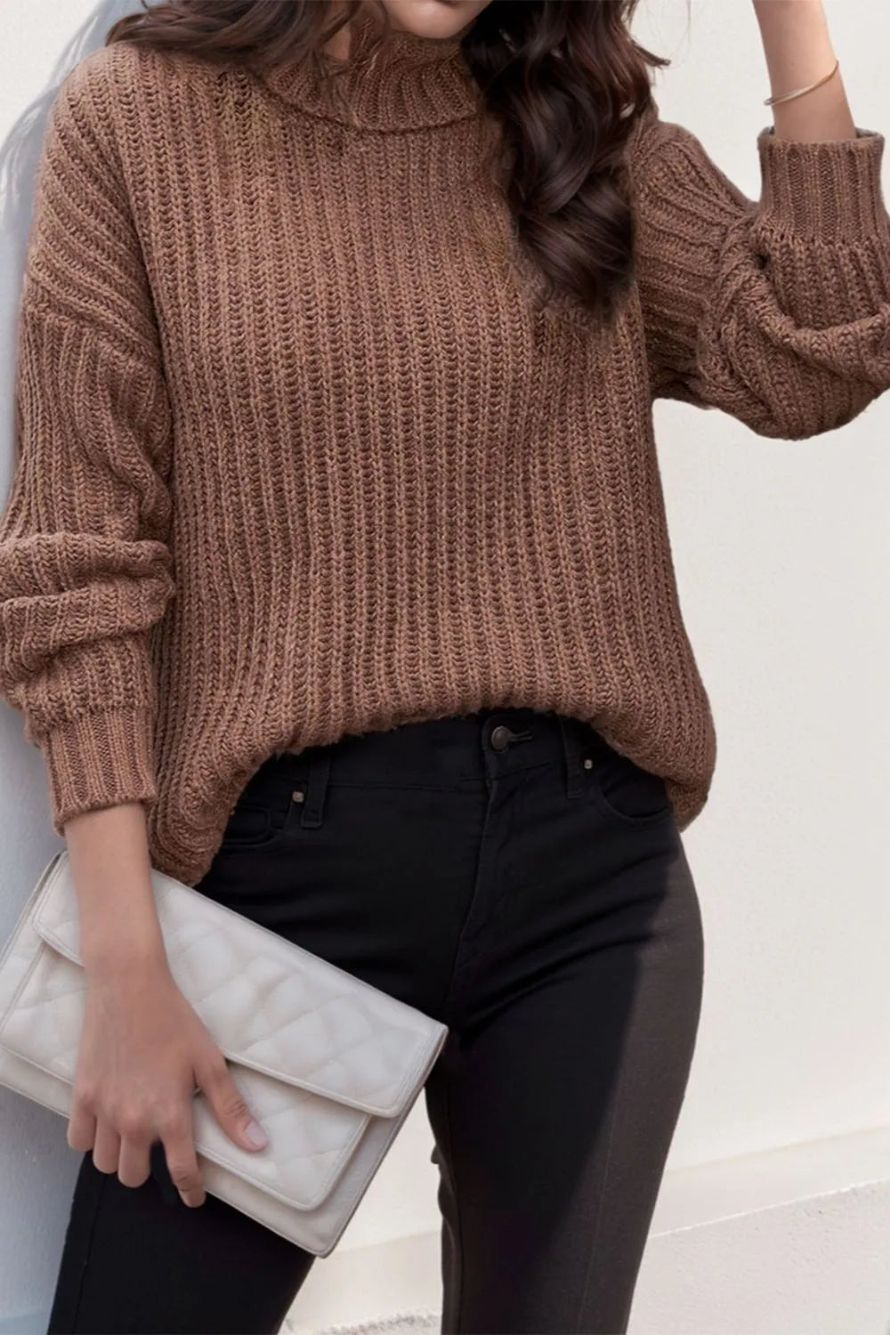 Brown turtleneck pullover sweater with long sleeves and ribbed cuffs and hem