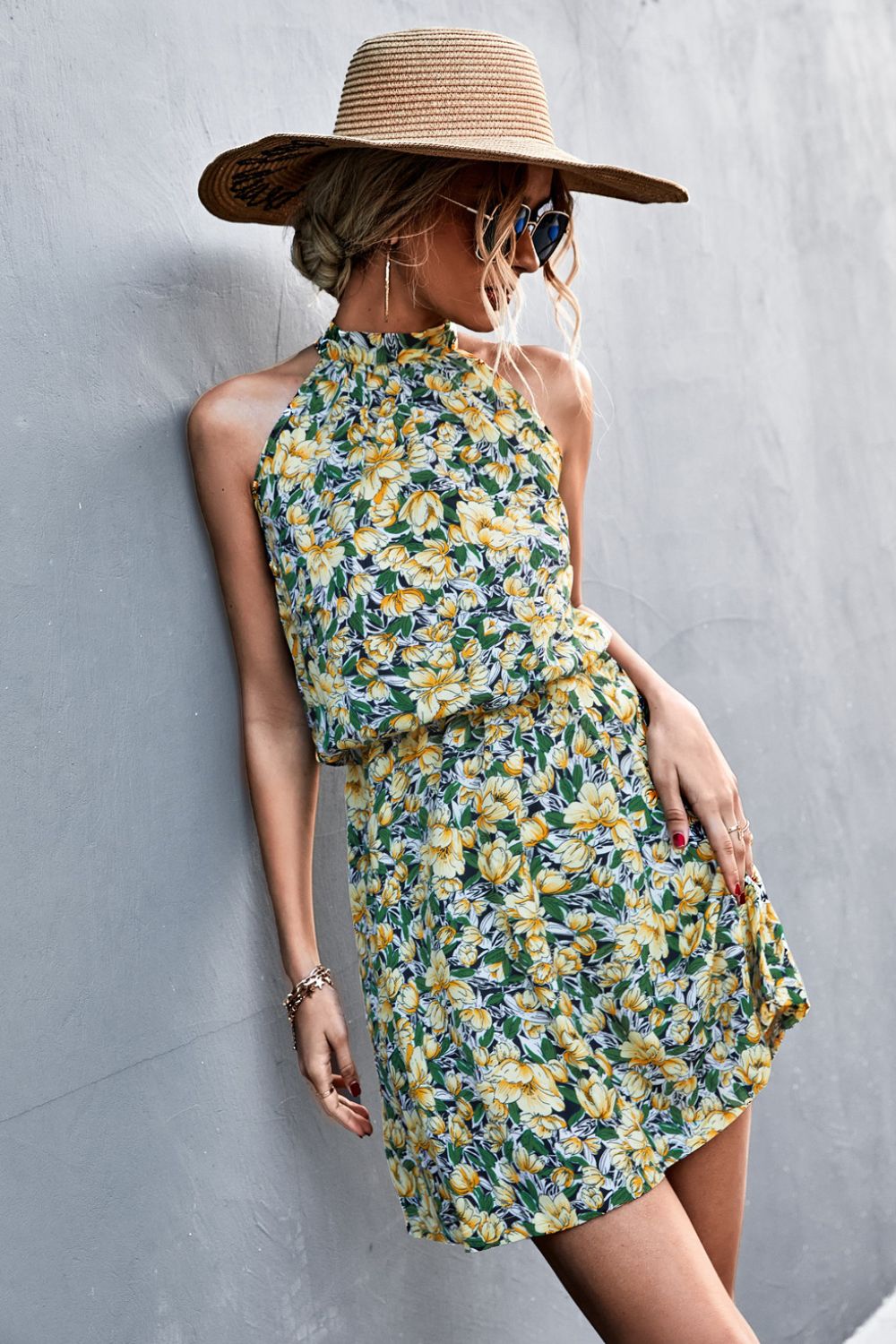 Floral tied sleeveless mini dress in yellow-green with halter neckline and gathered waist