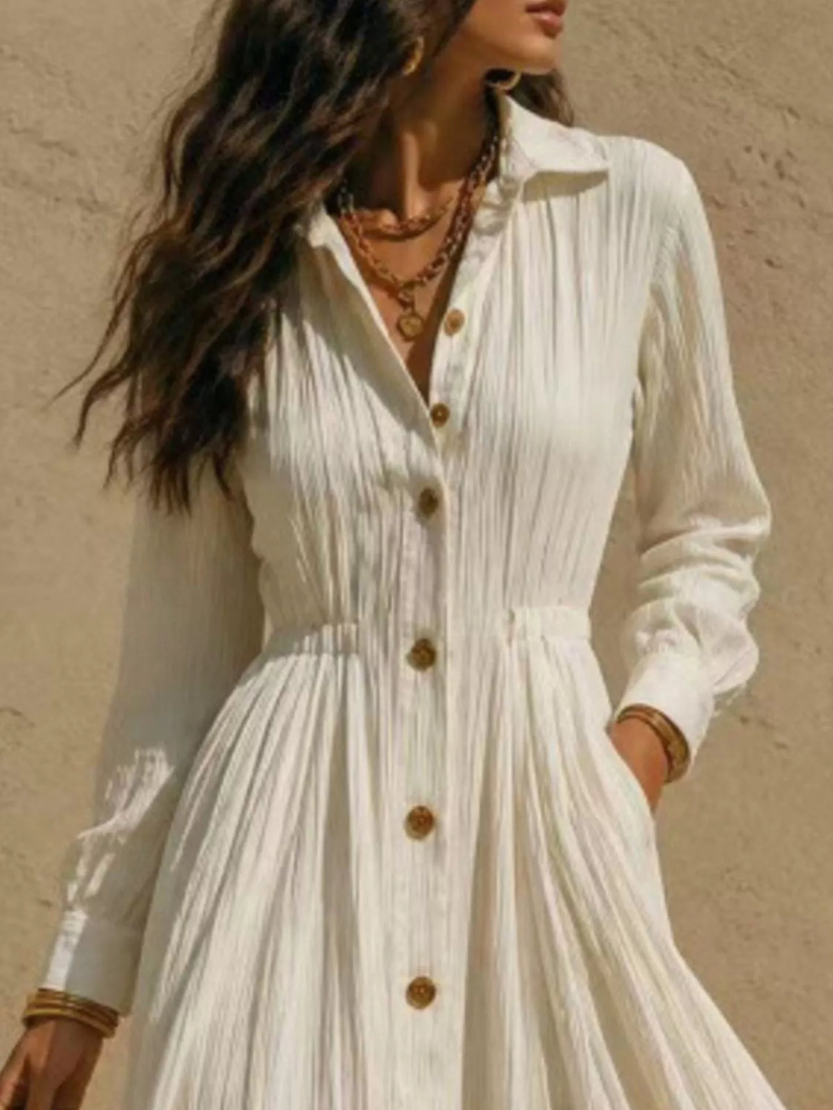 Cream button-front shirtdress bodice with gold-toned buttons and textured placket