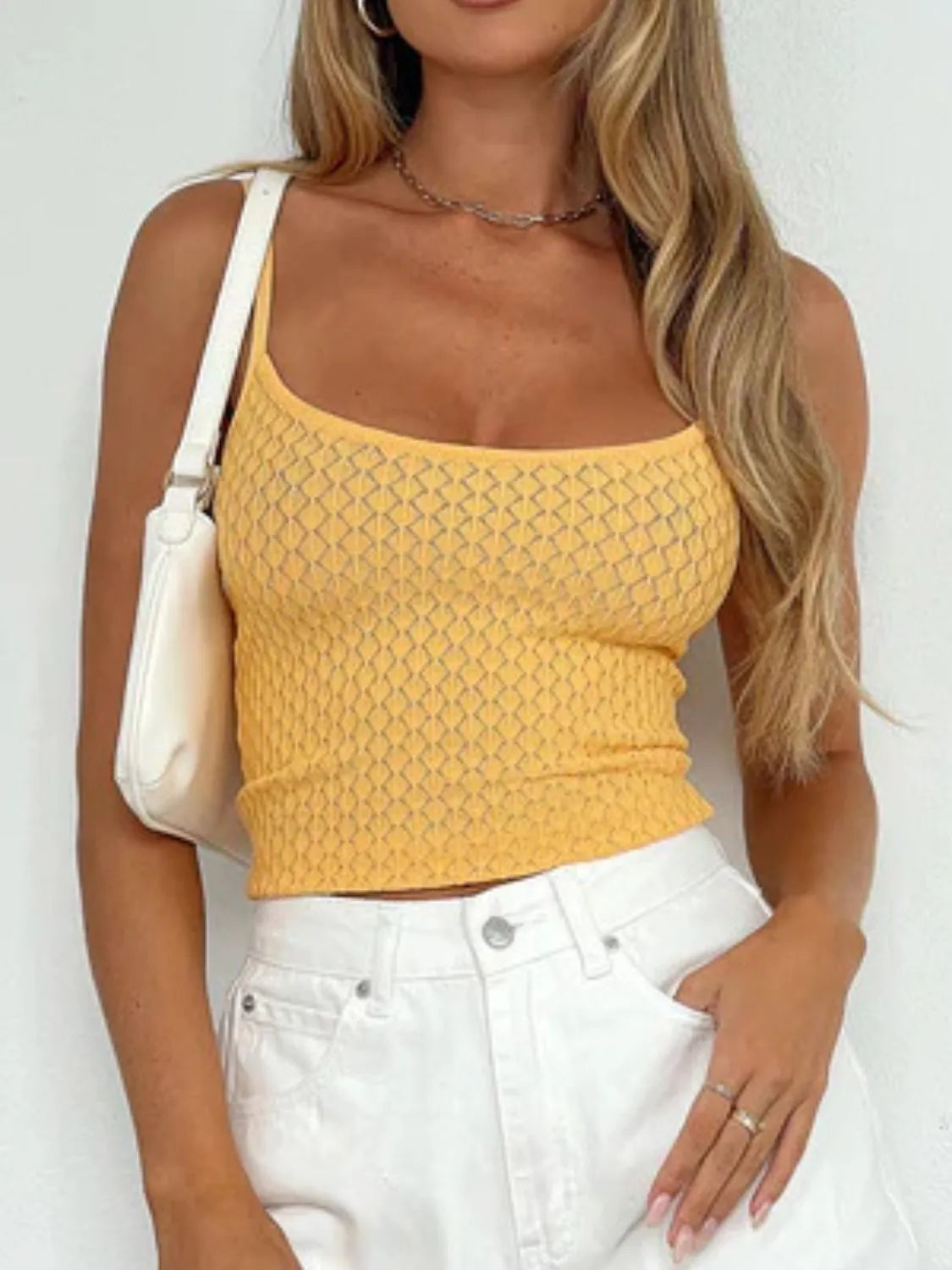 Gold lace square-neck cami with thin straps, textured knit front, cropped fitted top.