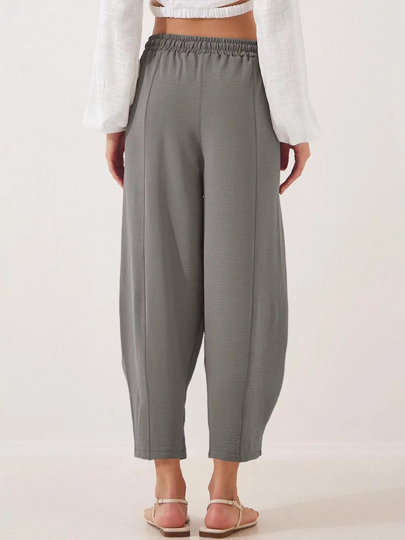 Ankle-length wide-leg pants in gray with elastic waist and drawstring