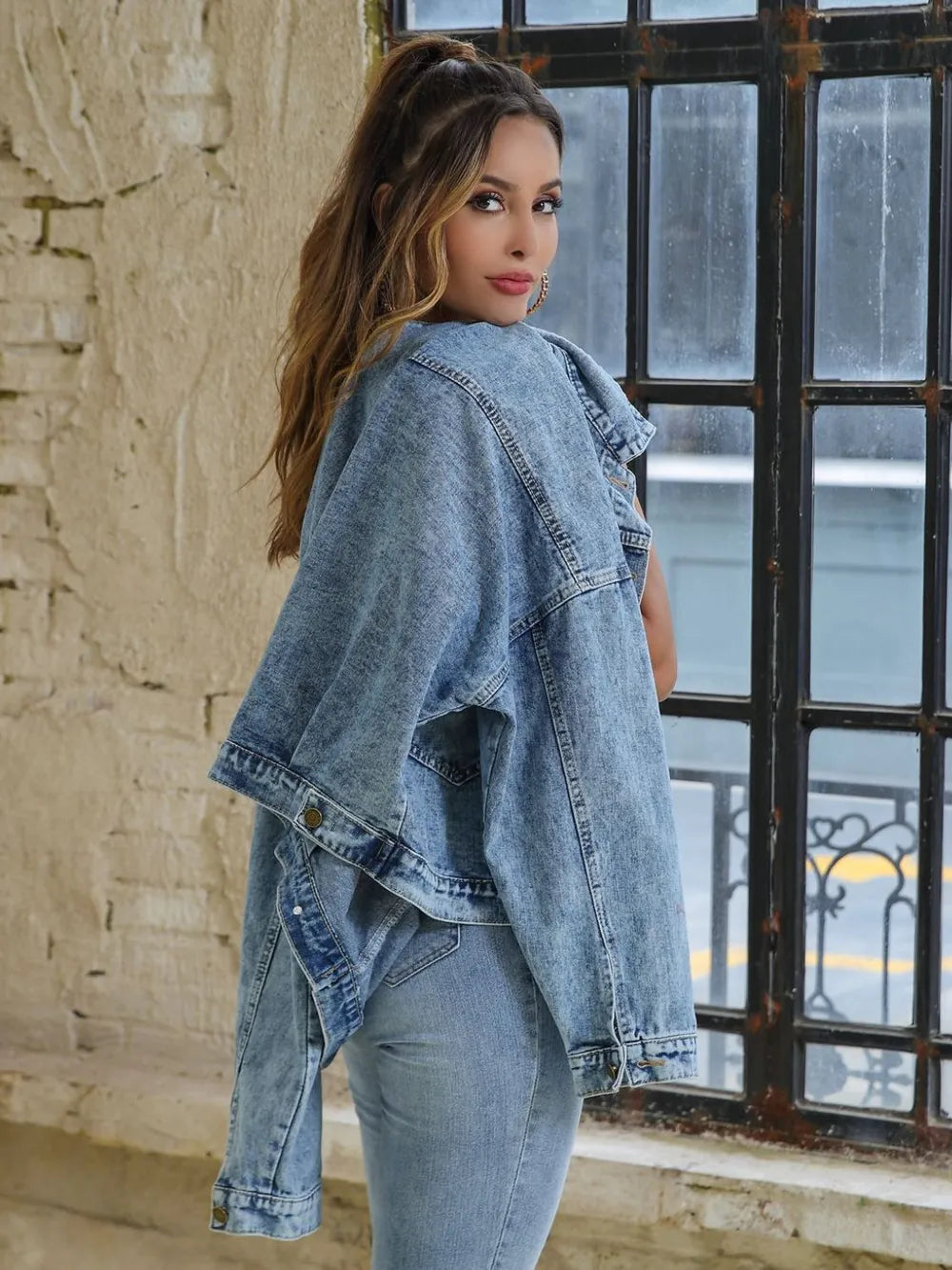 Light-wash denim drop-shoulder button jacket, back view with wide sleeves