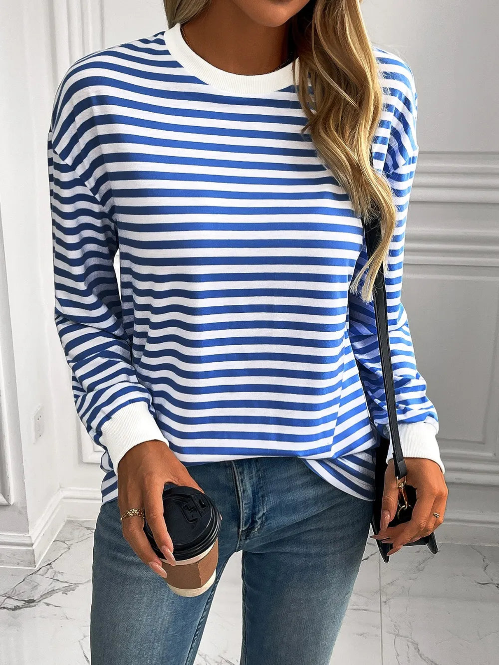 Striped crewneck long-sleeve sweatshirt in blue and white, front view