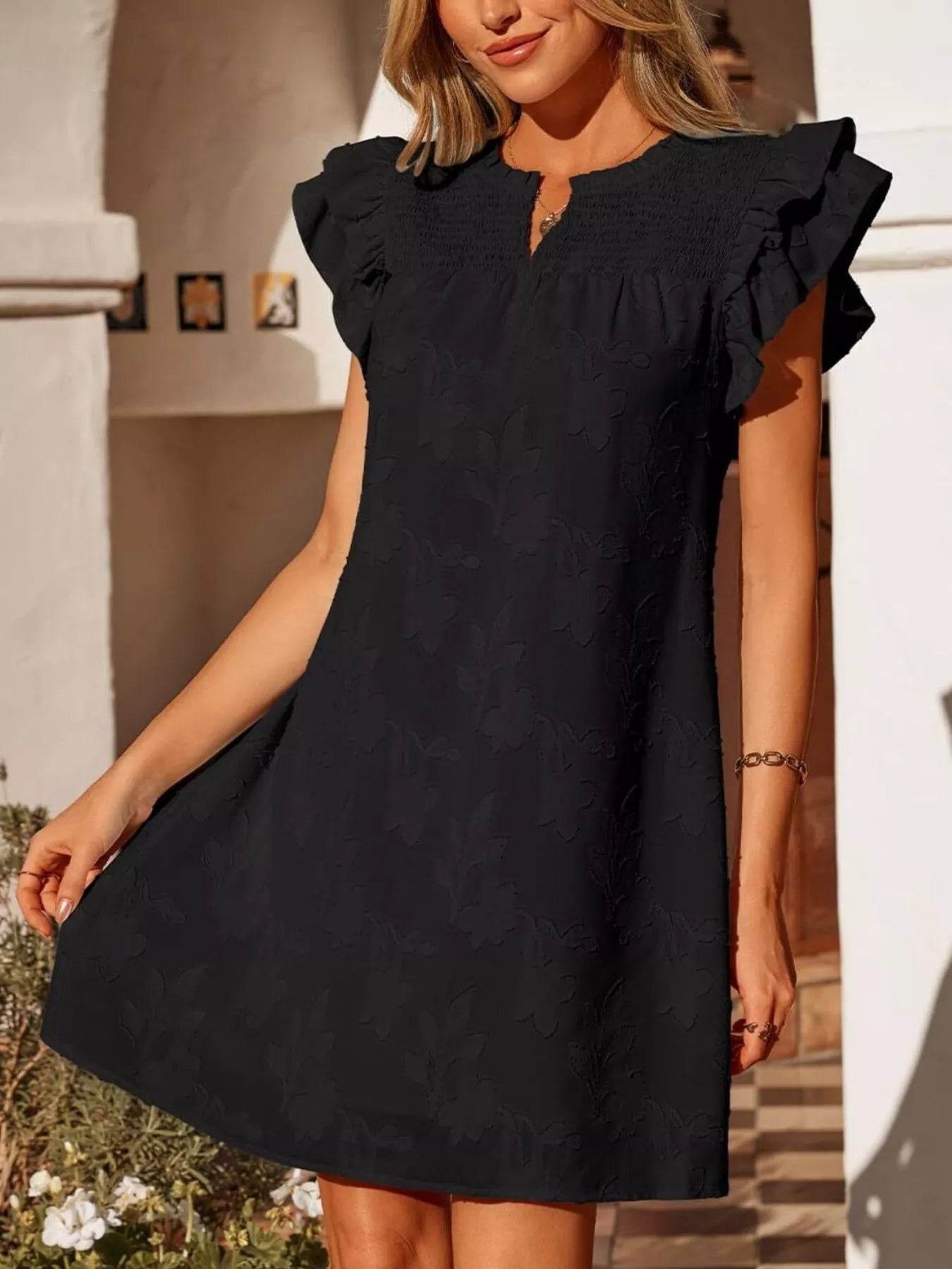 Floral embossed ruffle-sleeve mini dress in black with smocked yoke