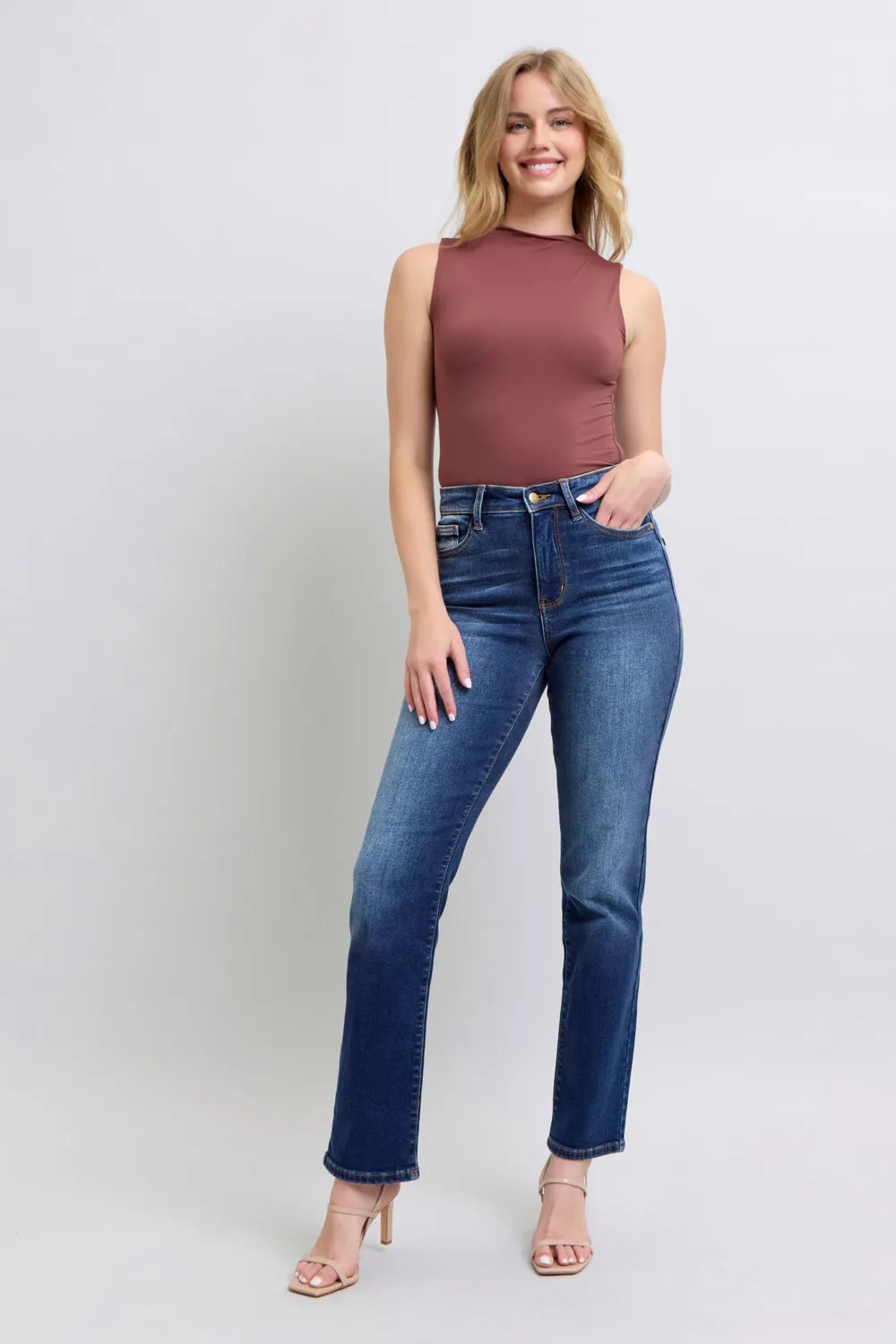 Washed dark blue straight-leg jeans with pockets and cuffed straight hems