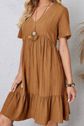 Caramel ruched V-neck short-sleeve dress with tiered skirt and gathered bust