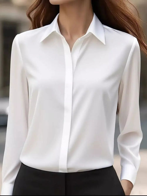 White button-down long sleeve shirt with pointed collar and front button placket