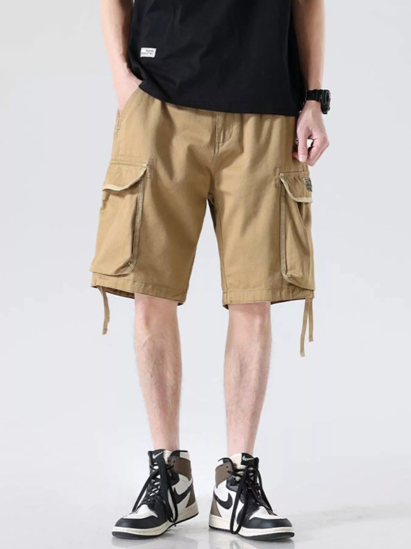Khaki cargo shorts with drawstring waist, side cargo pockets, hem ties and loose fit