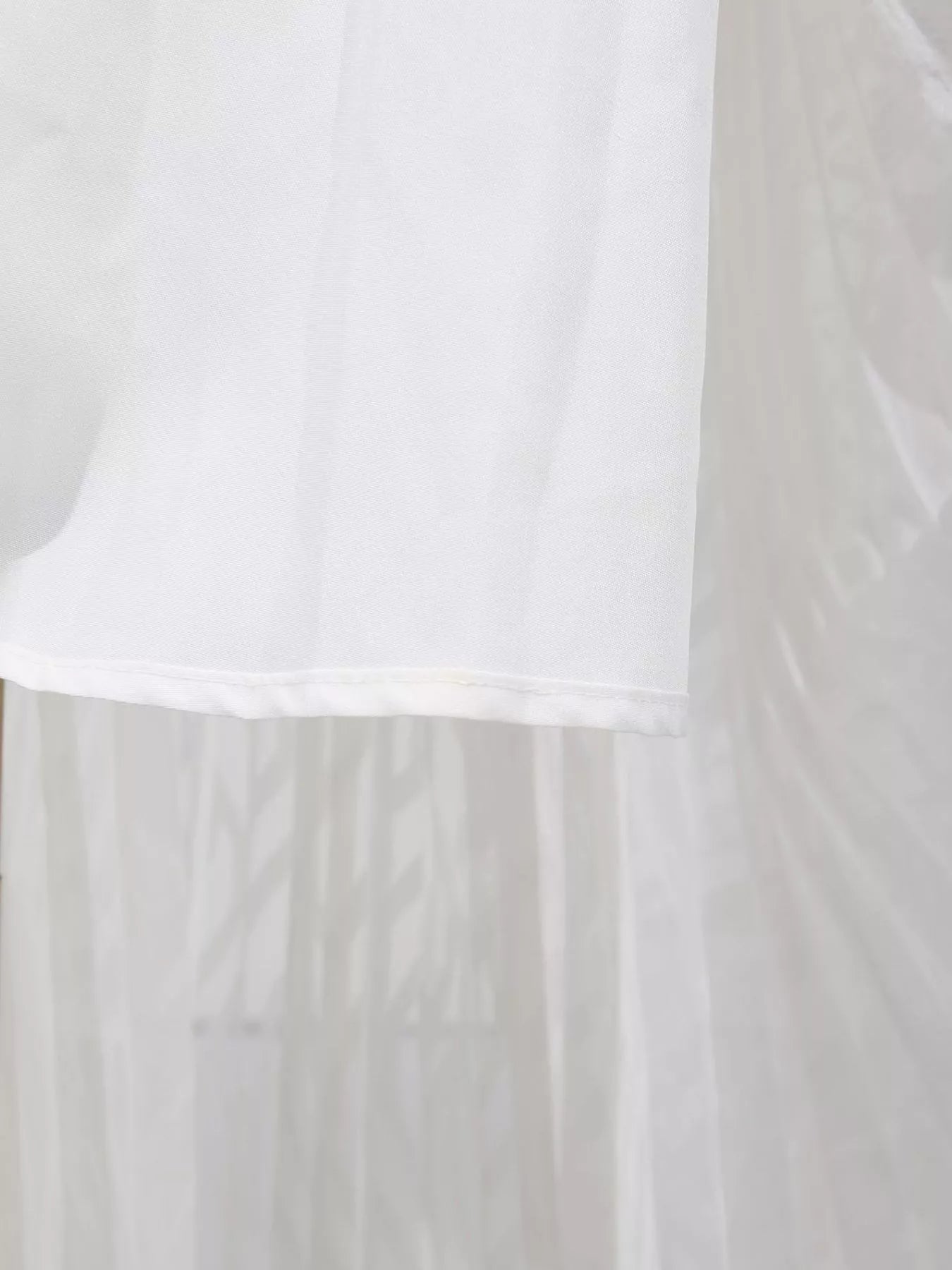 Cedar & Moore V-Neck Long Sleeve Maxi Dress in white fabric with hem detail