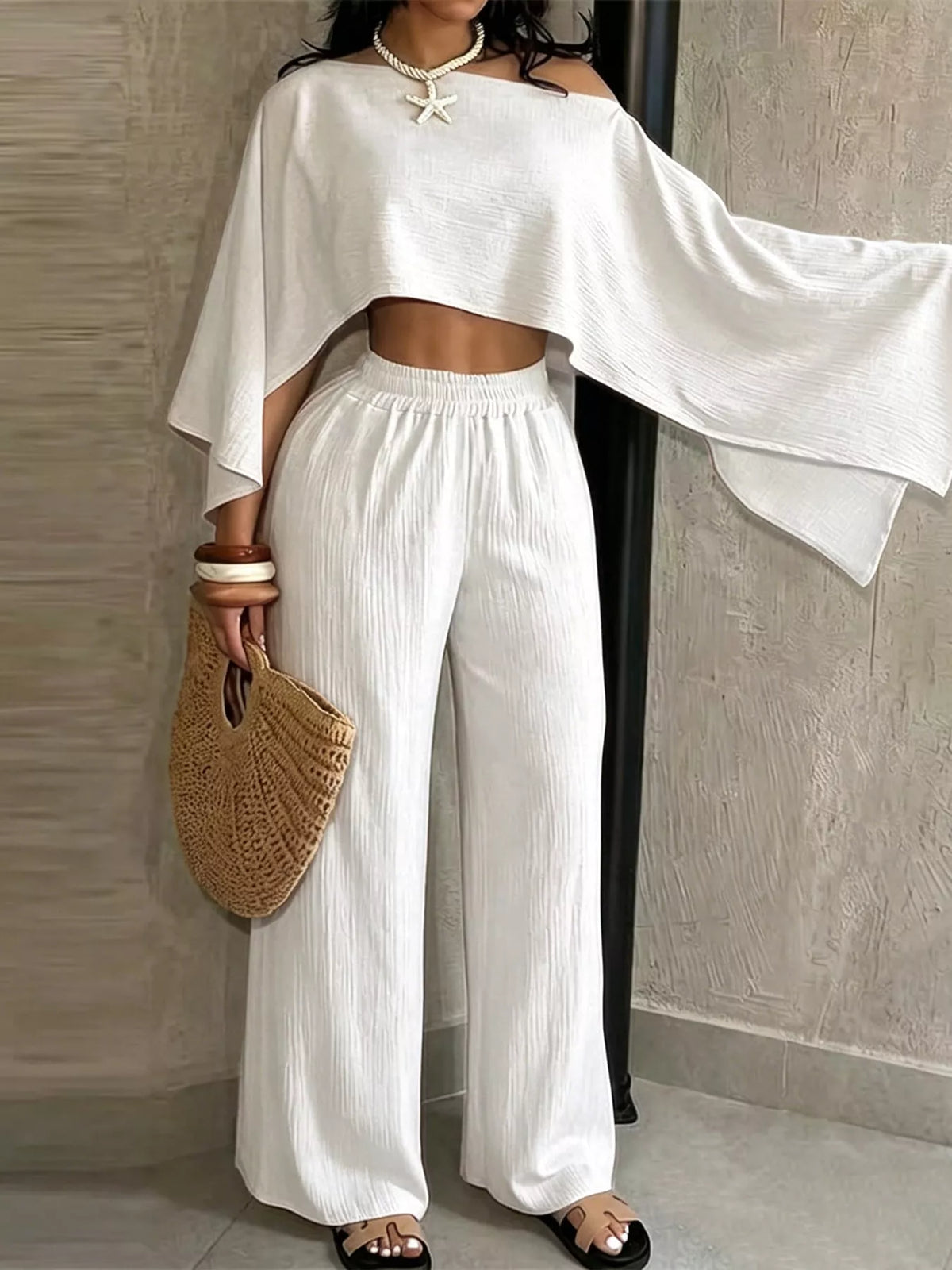 White boat-neck crop top and wide-leg pants set, loose cape sleeves with elastic waist