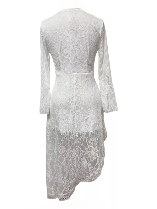 White lace asymmetrical hem dress, back view, long sleeves and fitted waist