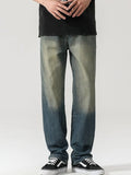 Men's washed teal denim jeans with wide-leg fit and button fly, front view