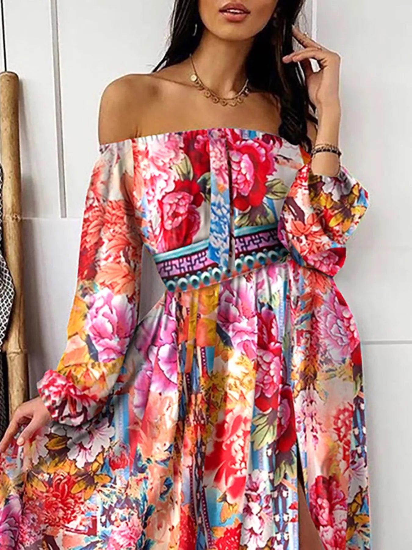 Pink floral off-shoulder maxi dress with long puff sleeves and side slit