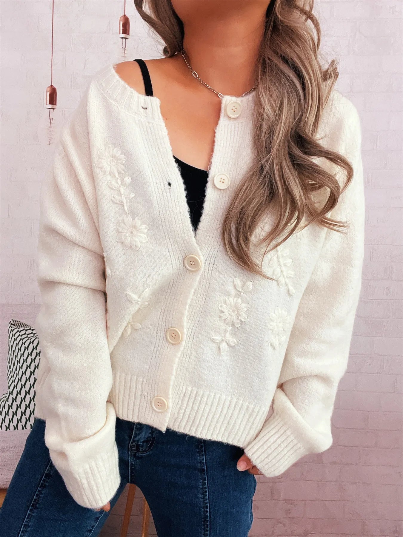 White cardigan with floral embroidery, V-neck button placket, ribbed cuffs
