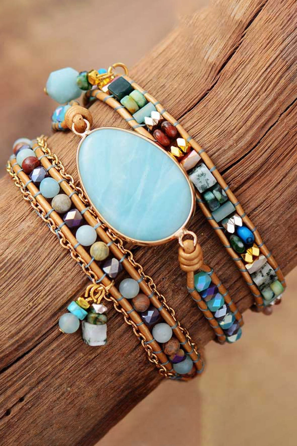 Triple-layer beaded bracelet with aqua oval stone, woven cords, and dangling bead fringe