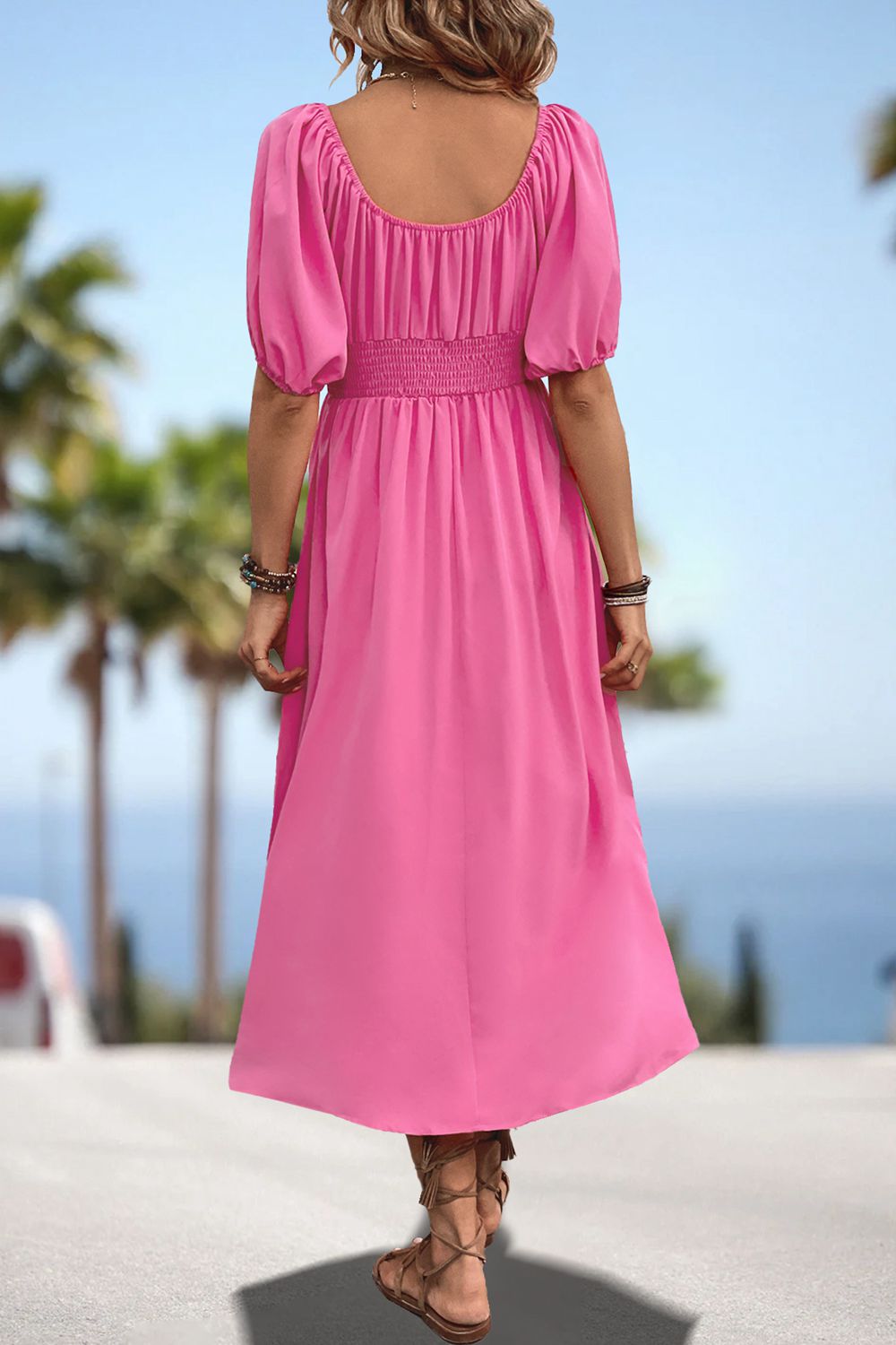 Pink smocked waist midi dress with puff sleeves and gathered back detail