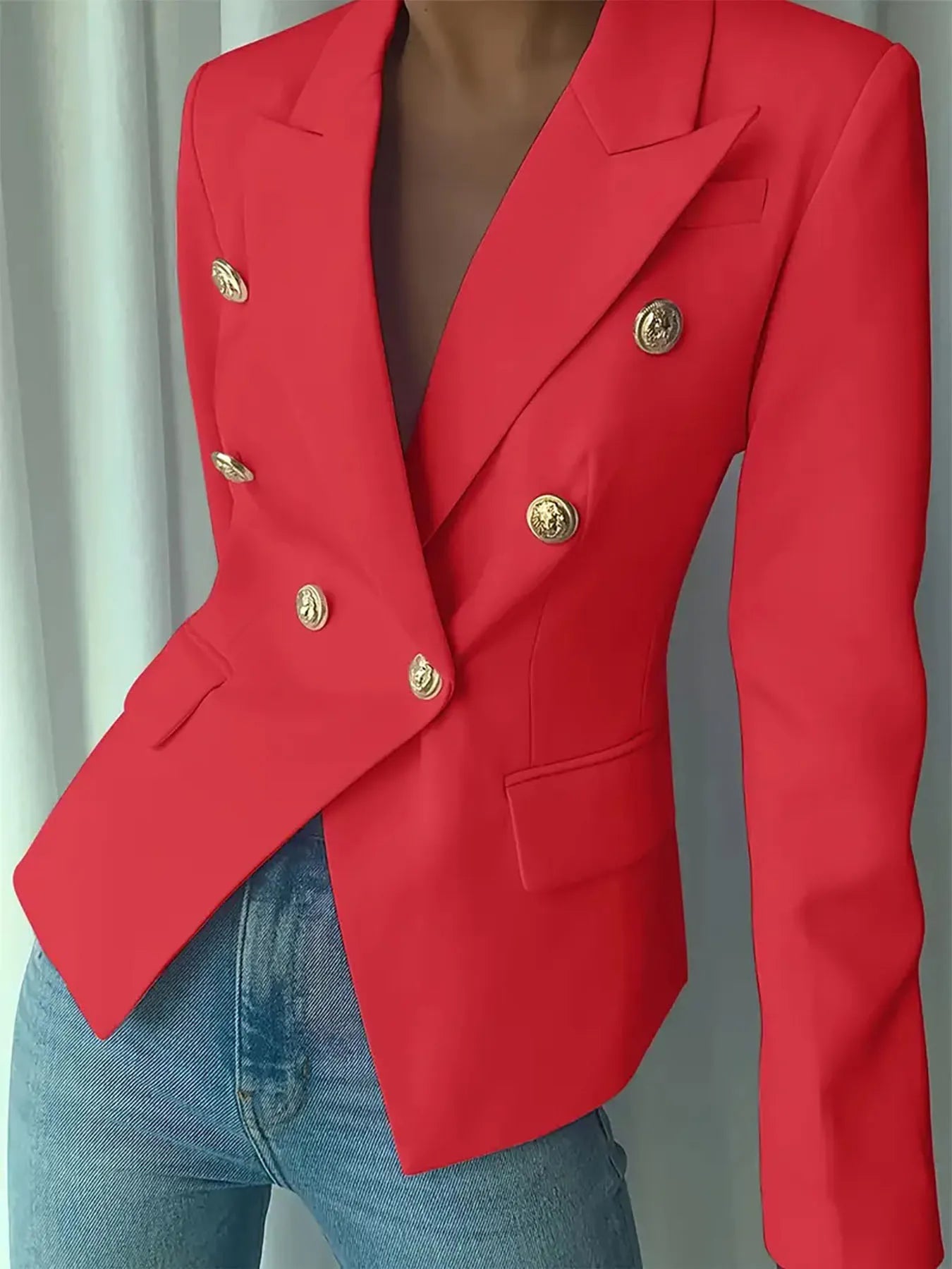Red blazer with notch lapel and gold decorative buttons, front flap pocket detail