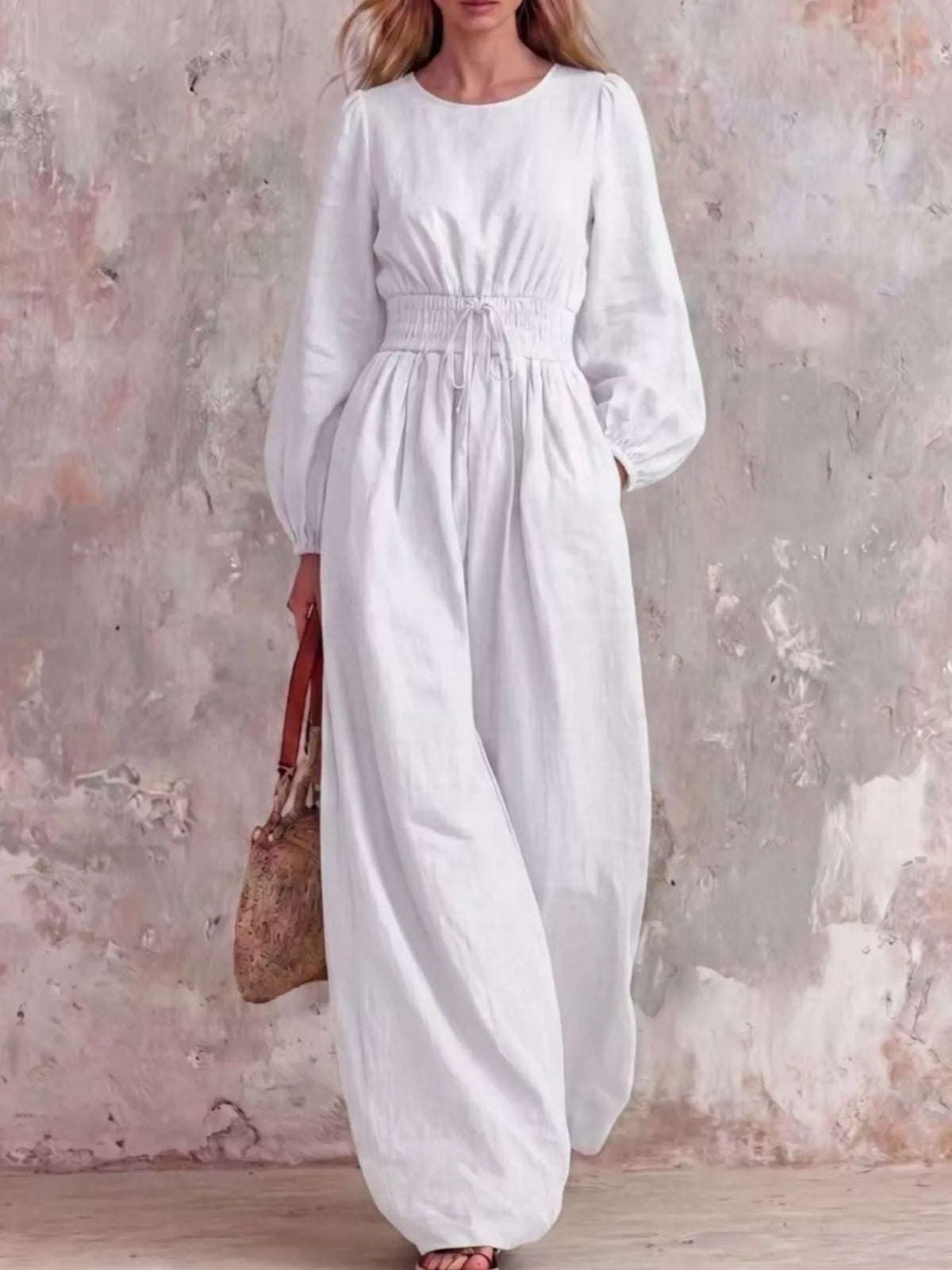 White smocked-waist long-sleeve jumpsuit with relaxed wide legs