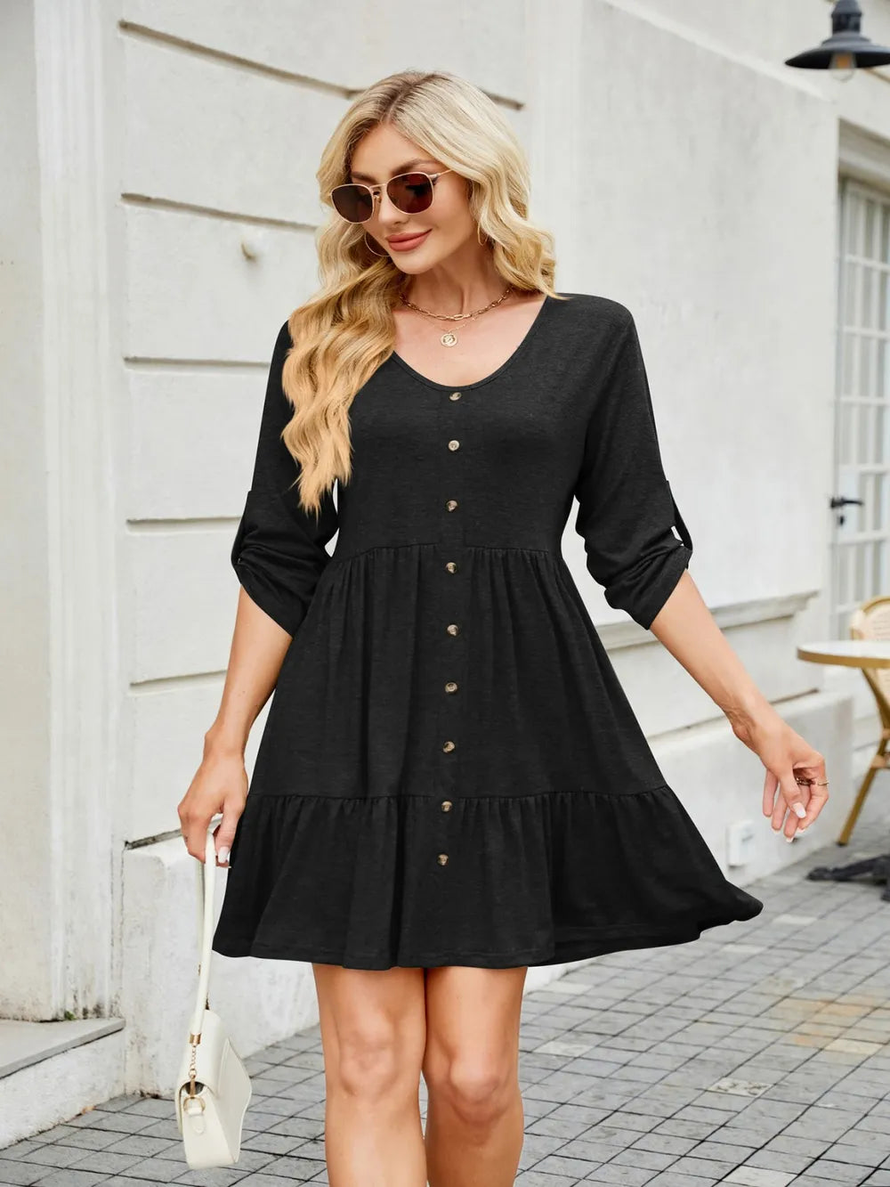 Tiered ruched V-neck mini dress in black with buttoned front