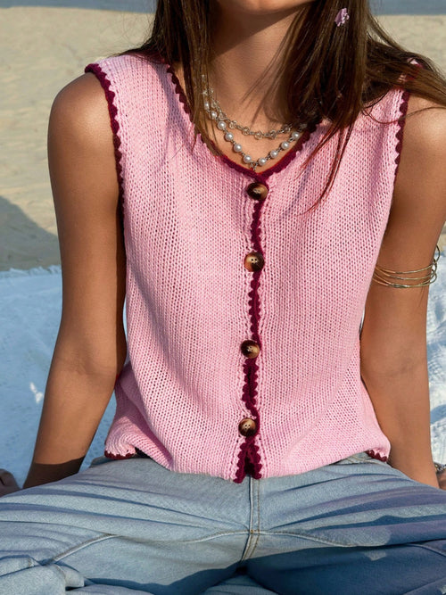 Pink knit button-down sweater vest with sleeveless round neckline and button front