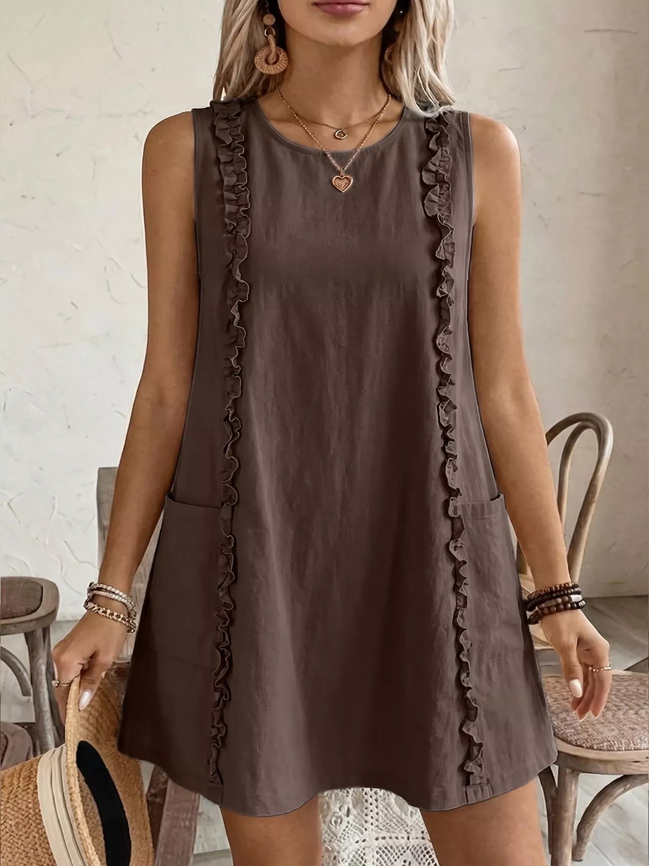 Cedar & Moore Frill Sleeveless Round Neck Dress in brown fabric with ruffle trim and pockets