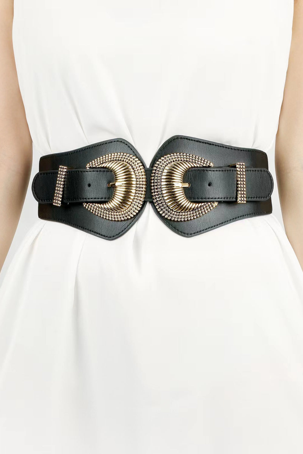 Black elastic wide belt with double shell buckle, gold-tone detailing, and rectangular keeper