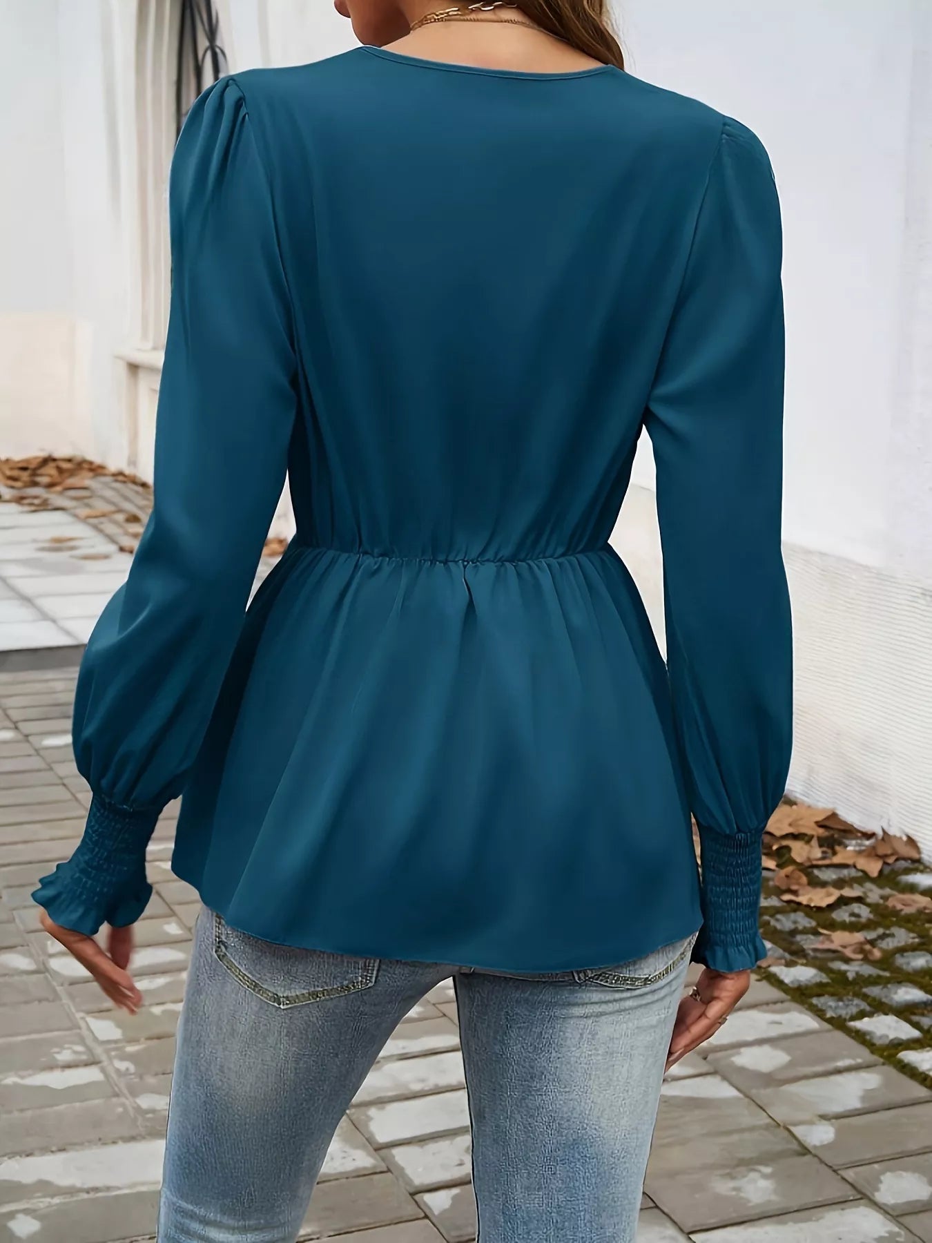 Knot Front Lantern Sleeve Blouse in teal with cinched waist and smocked cuffs.