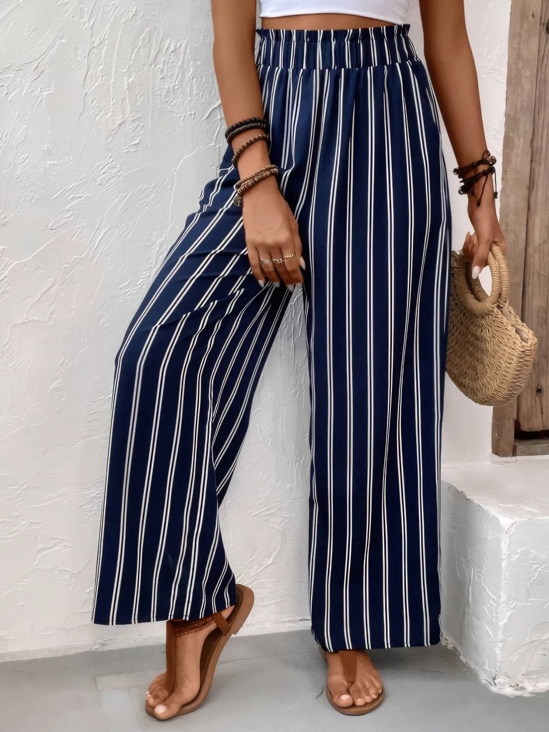 Dark navy striped wide-leg pants with elastic waistband and relaxed wide-leg fit