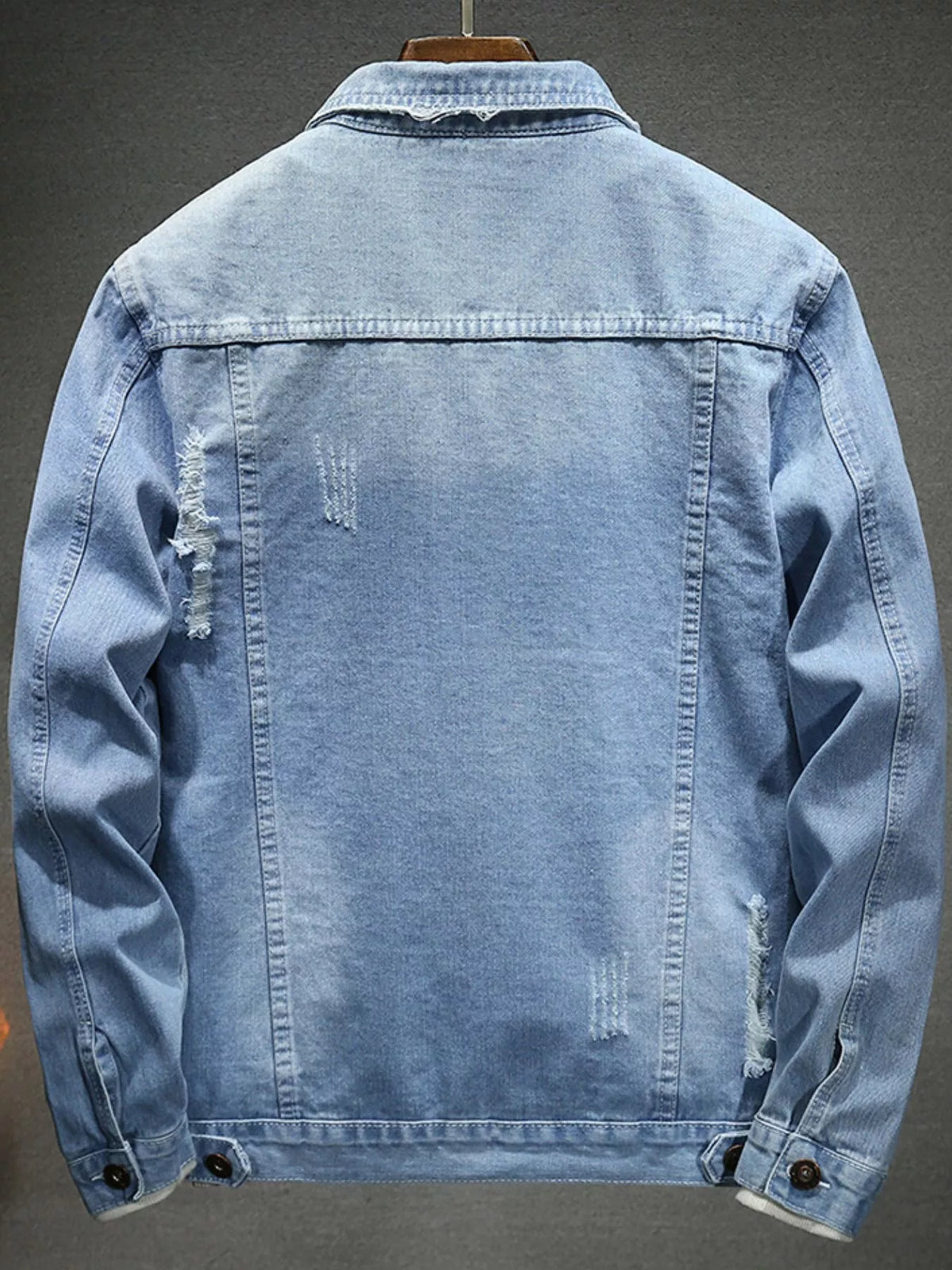 Light blue distressed denim jacket, slim fit, back view, button cuffs and seams