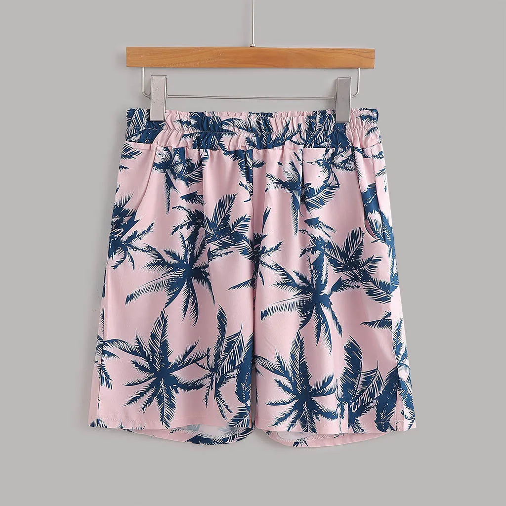 Pink tropical print shorts with elastic waistband