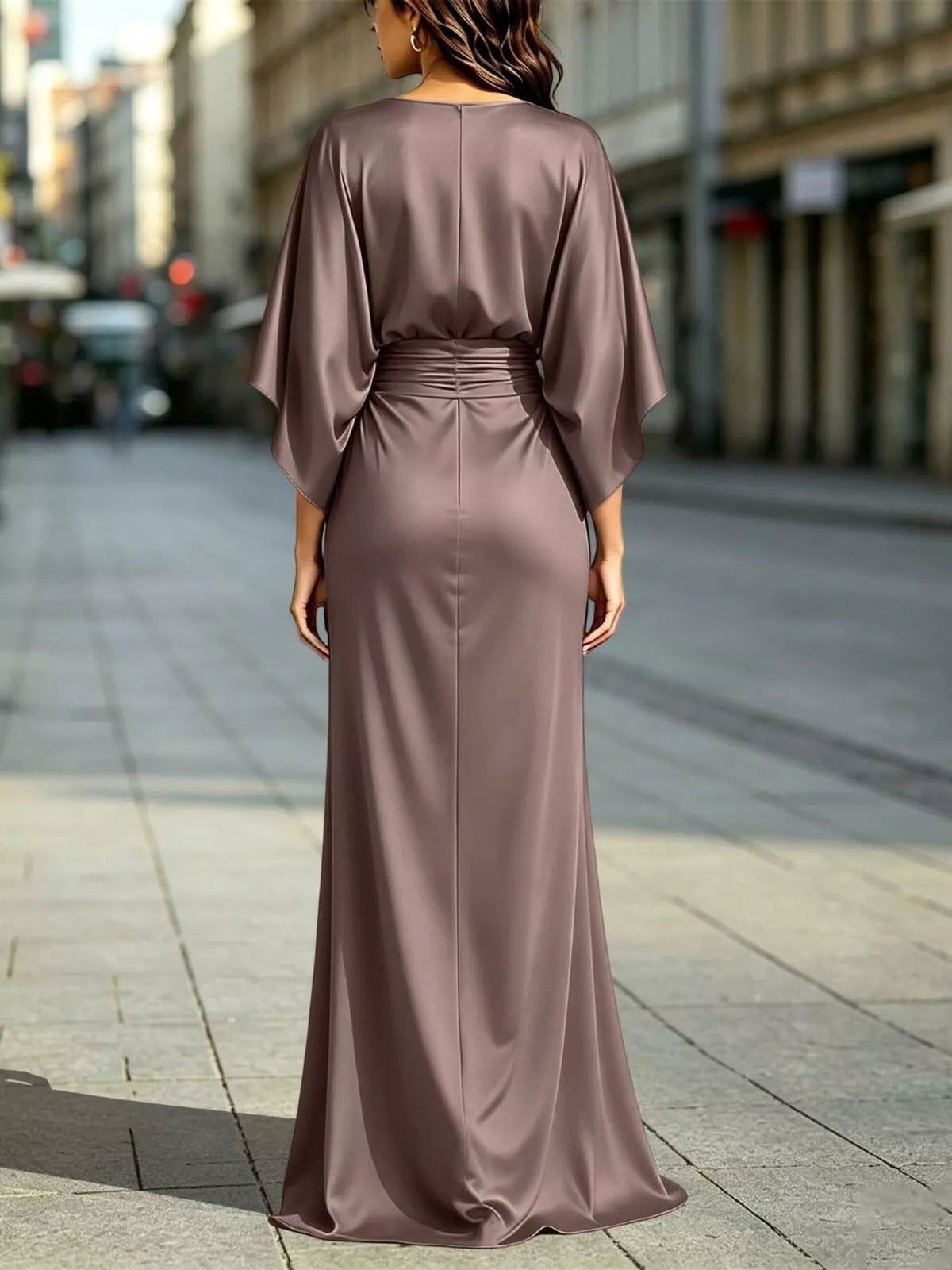 Back view of taupe satin maxi dress with ruched waist and draped sleeves