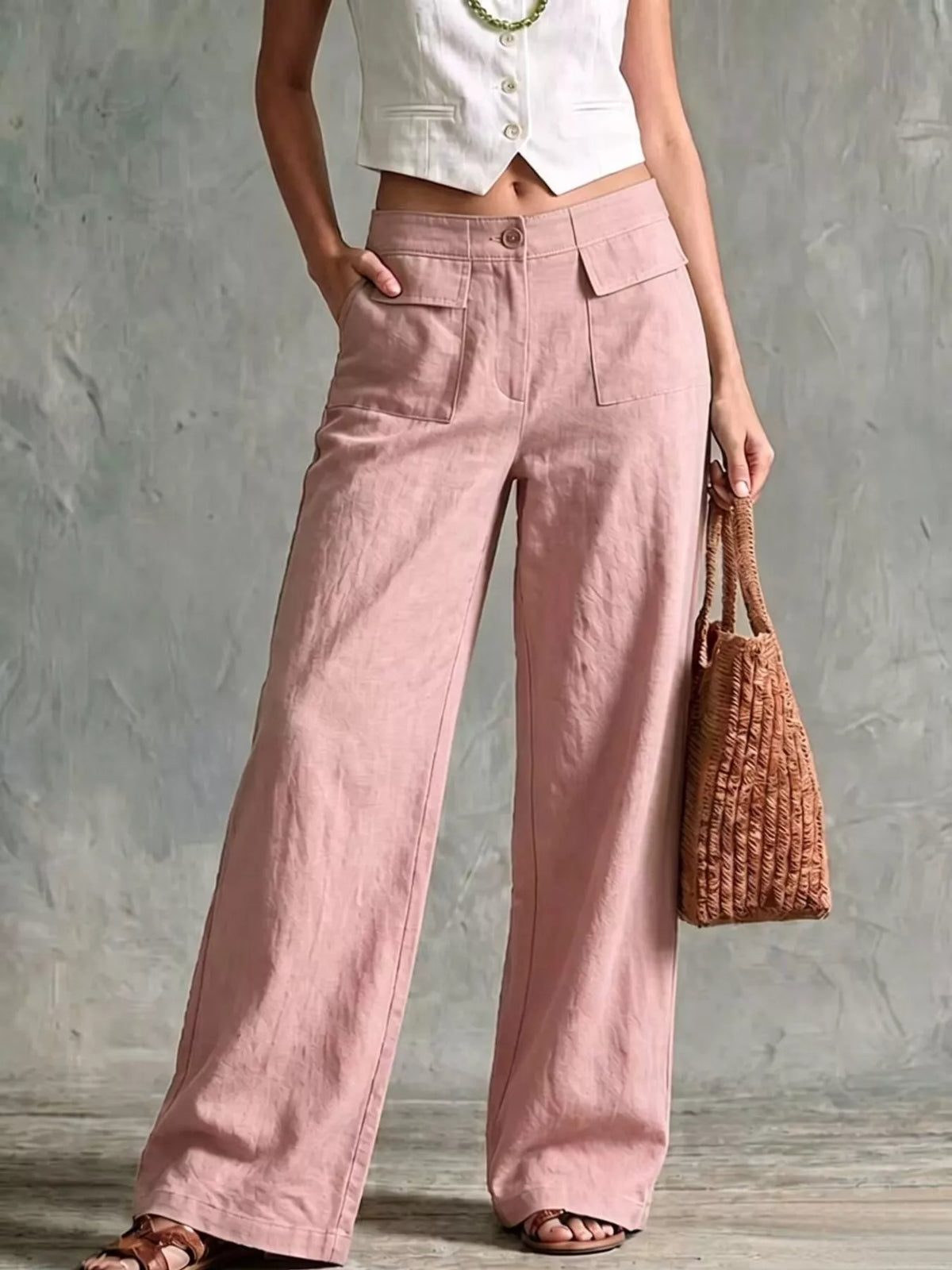 Dusty pink high-waist wide-leg cargo pants with flap pockets and button front