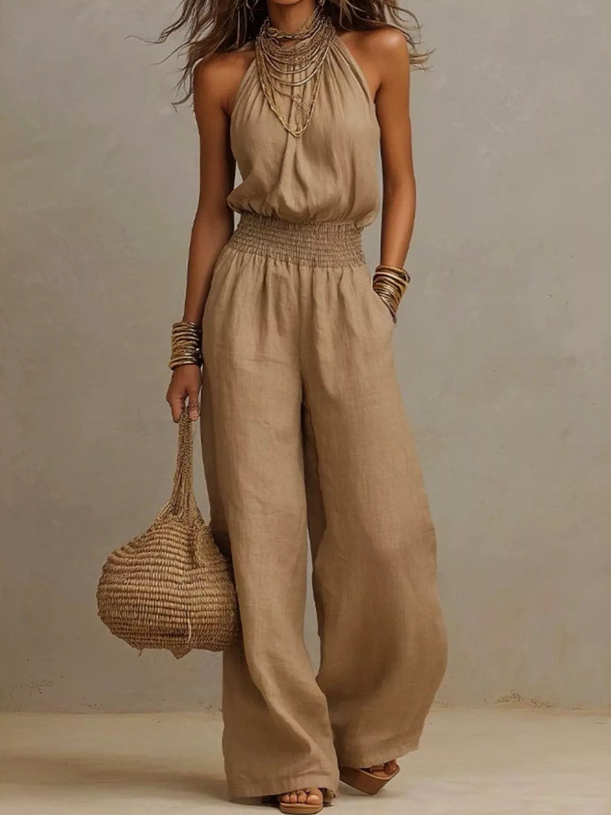 Pocketed halter neck wide-leg jumpsuit in light brown, sleeveless halter with smocked waist