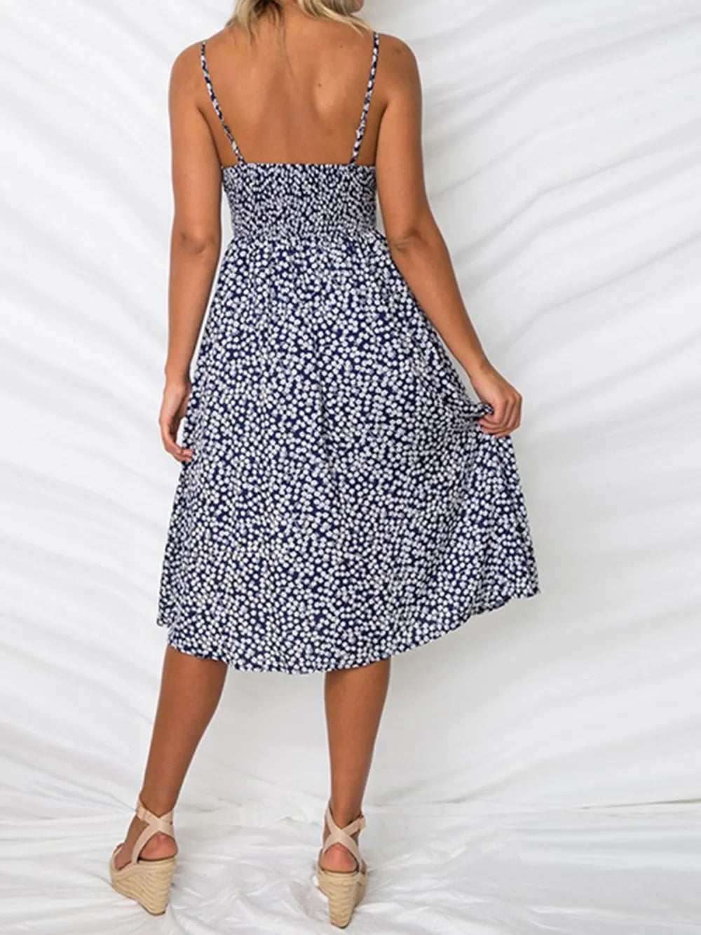 Navy blue floral cami dress with sweetheart cutout tie front and button detail skirt