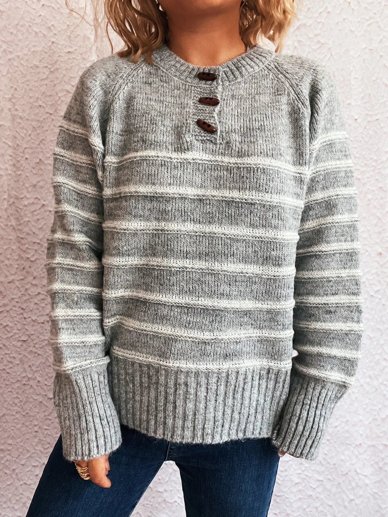 Light gray striped long sleeve sweater with button placket and ribbed hem