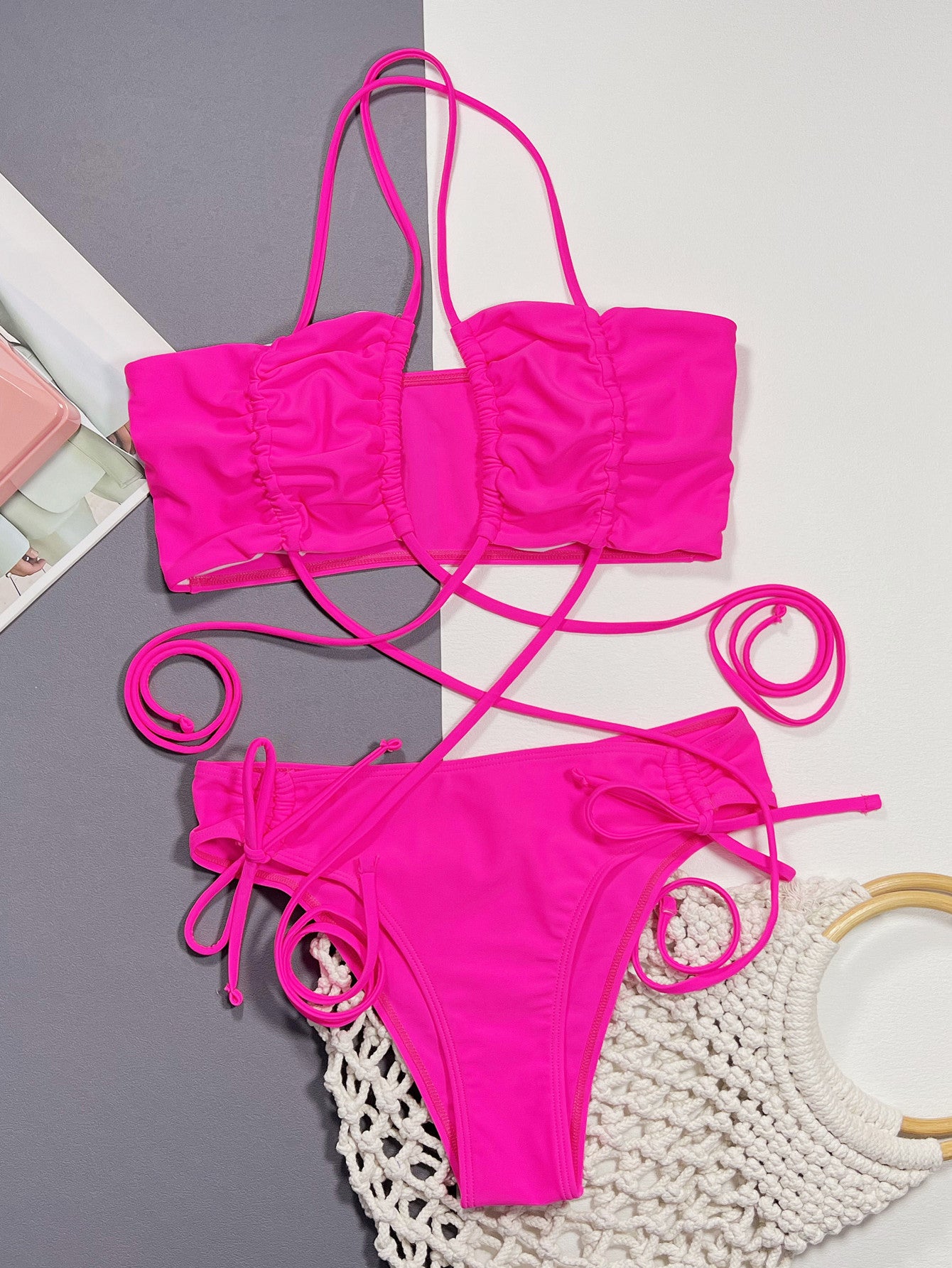 Hot pink halter bikini set with ruched drawstring top and high-cut bikini bottoms