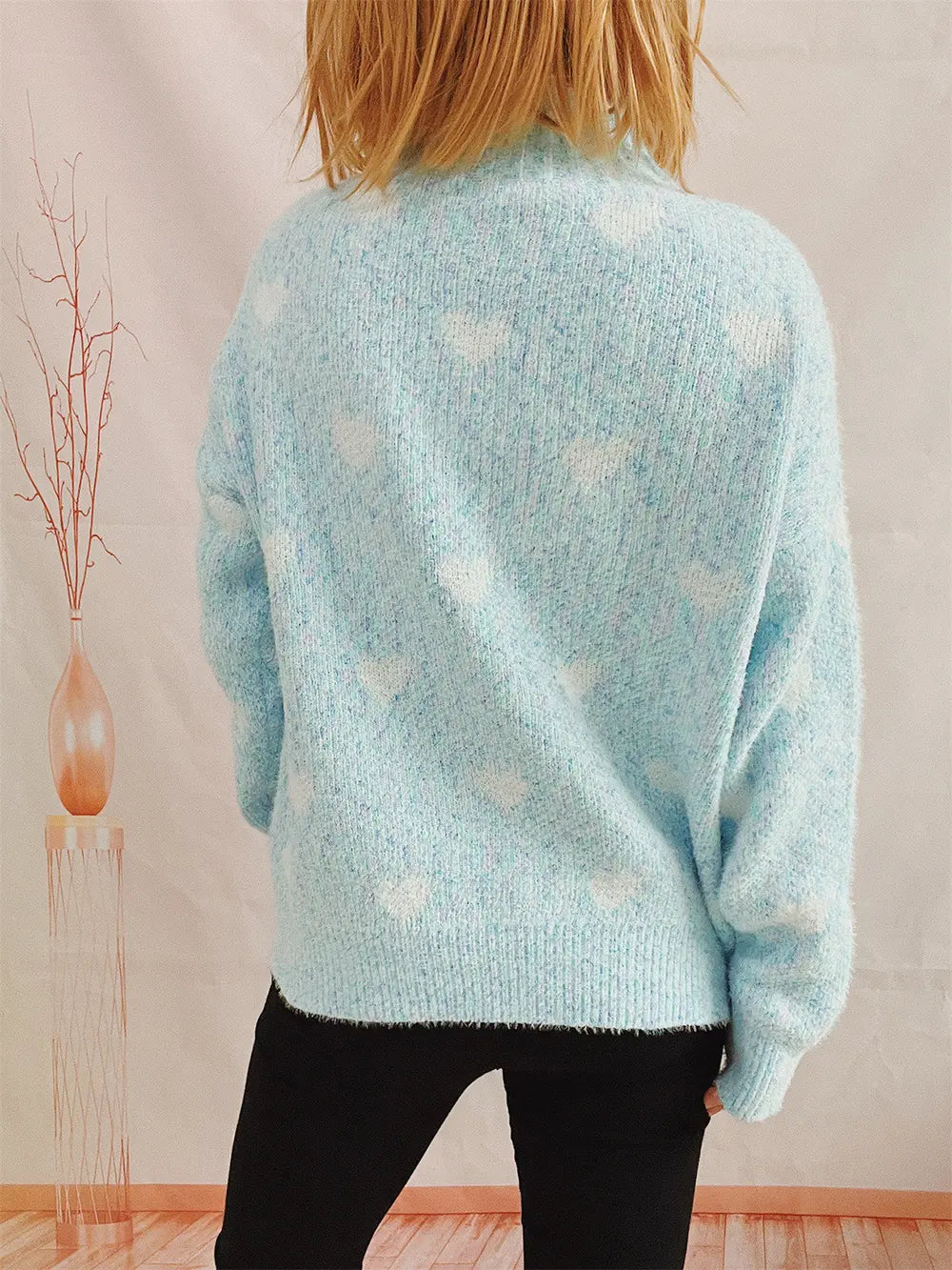 Heart-patterned heathered light blue turtleneck drop-shoulder sweater, back view