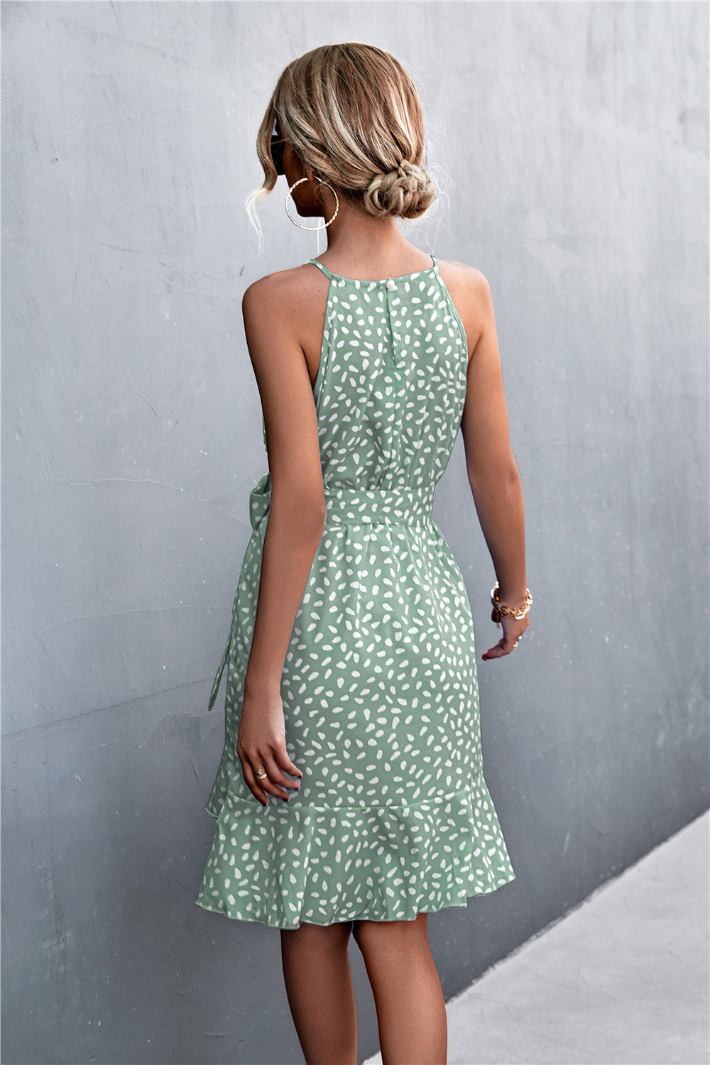 Gum leaf green tie-waist sleeveless dress, back view, white speckle print, ruffle hem