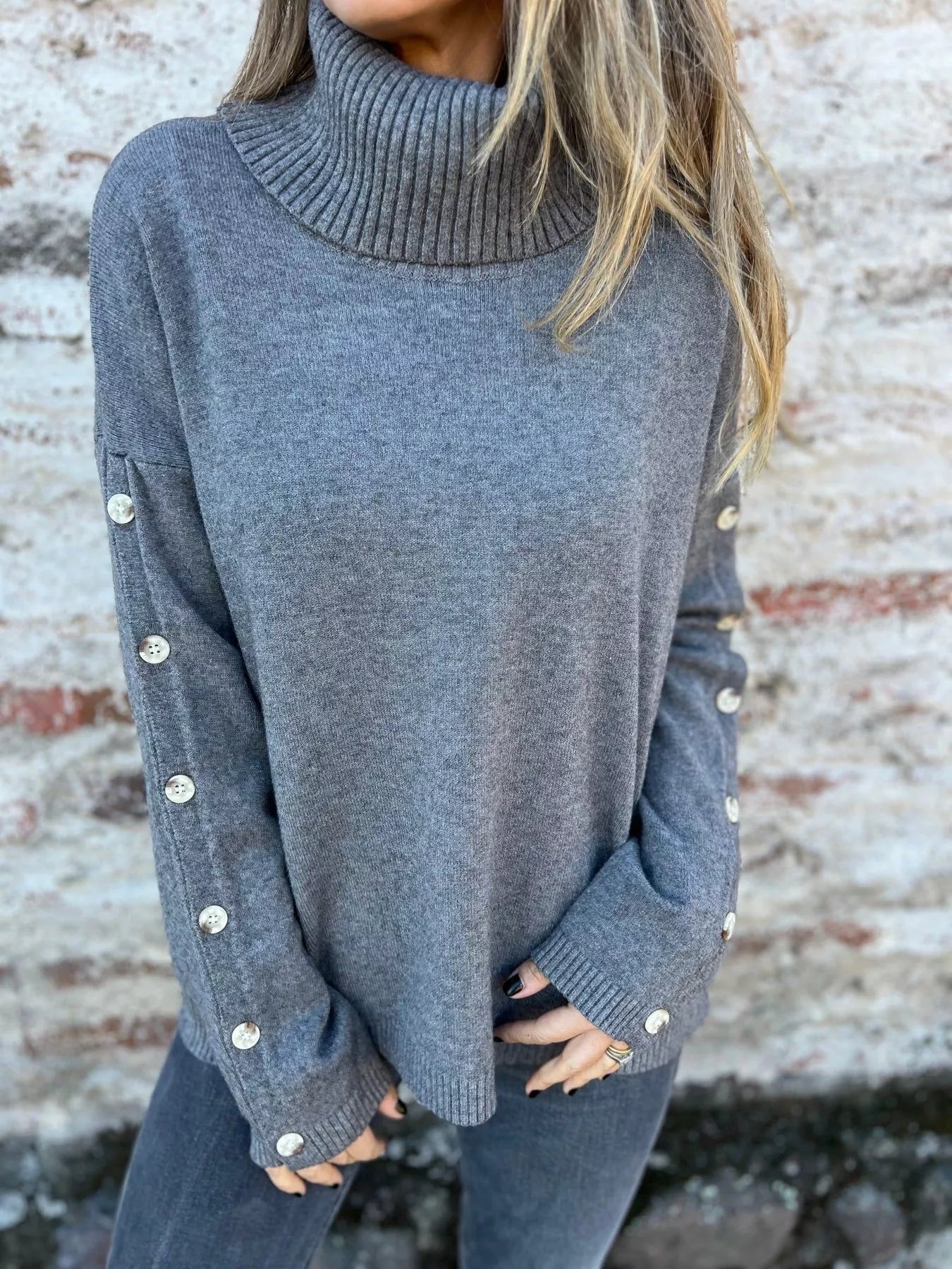 Heather gray turtleneck long sleeve sweater with ribbed collar and buttoned cuffs