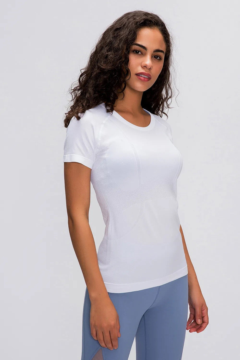 White round-neck short-sleeve active t-shirt with fitted silhouette.