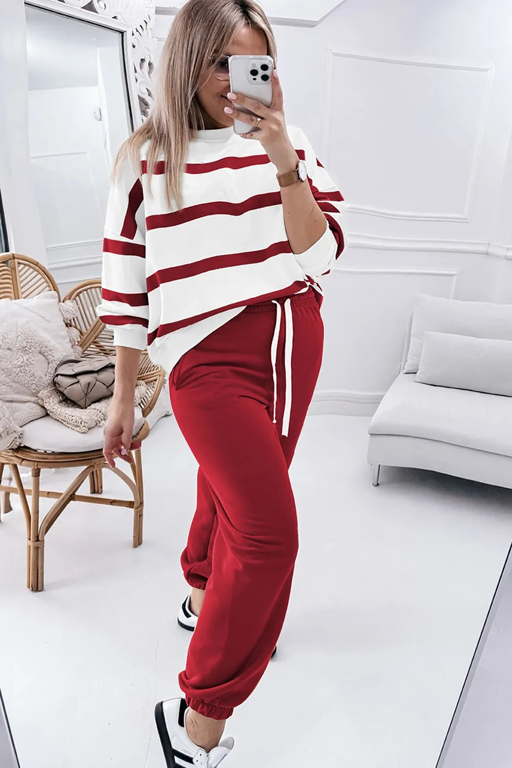 Red-and-white striped long-sleeve top with red jogger pants, drawstring hem