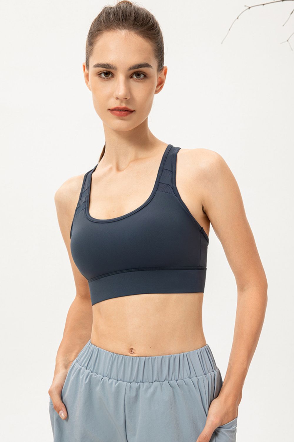 Long sports bra, deep teal scoop neck with smooth stretch fabric and wide hem
