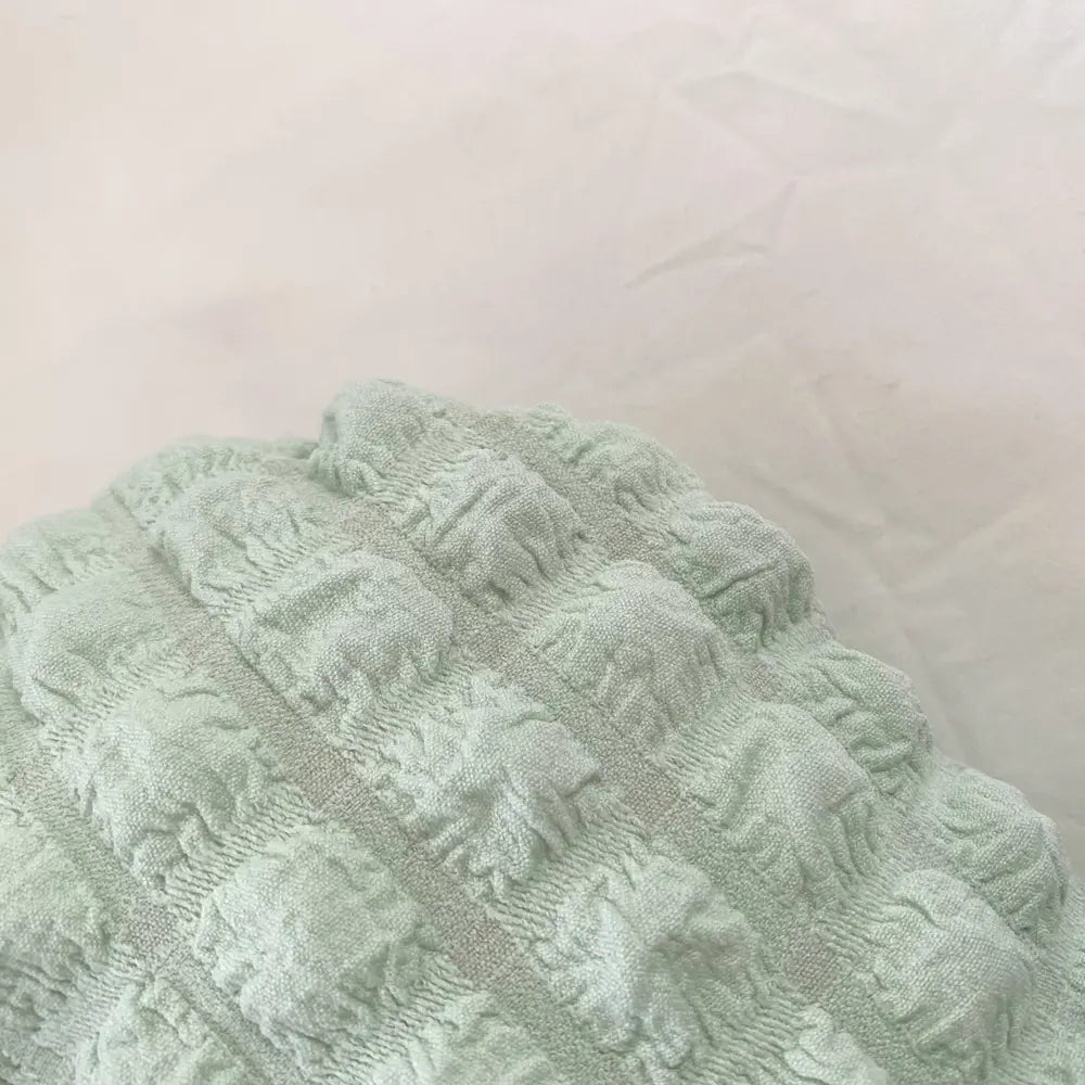 Light green textured small hobo handbag fabric detail with braided handle